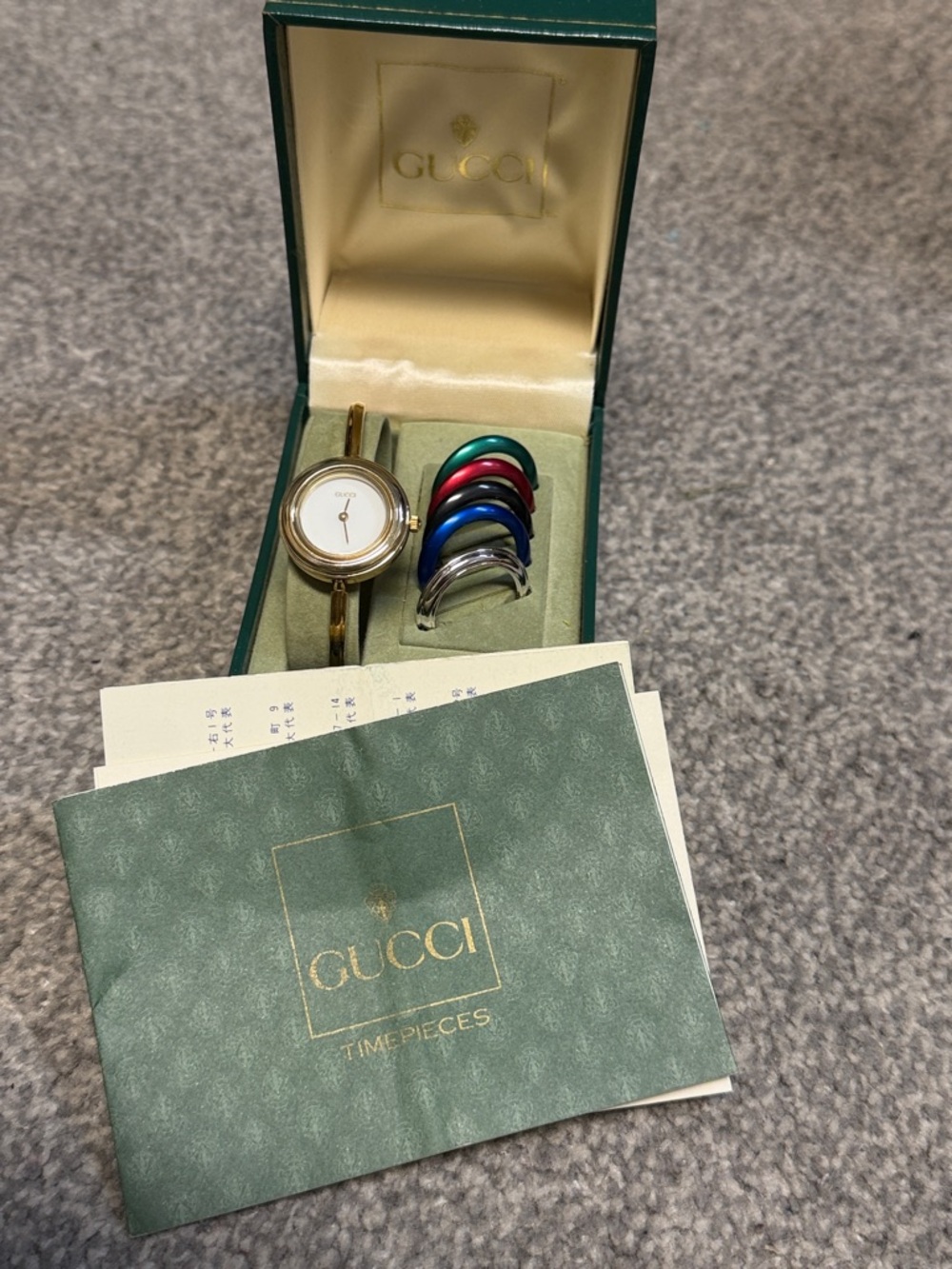 Gucci Gold-Tone Bracelet Watch with Green, Red, Blue, Purple and Silver Bezels